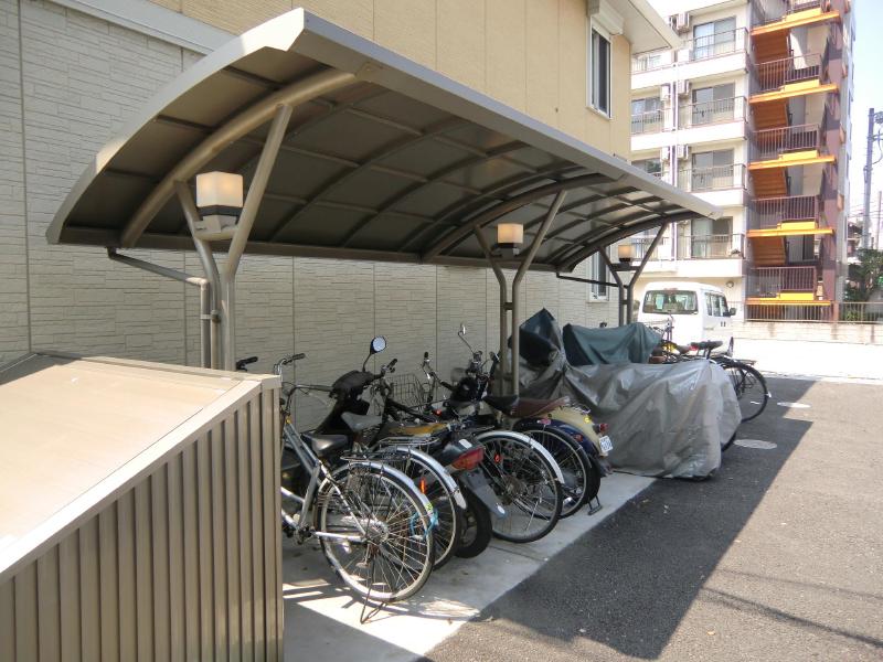 Building appearance. Bike storage is covered