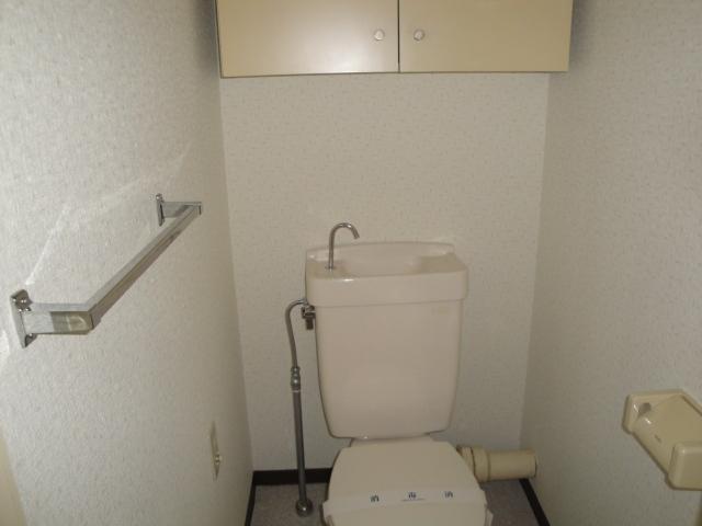 Toilet. Toilet is also easy to use and comes with a shelf