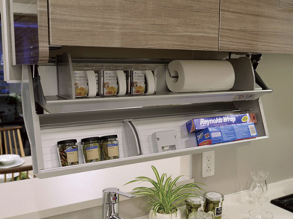 Kitchen.  [Eye-level shelf cupboard] The cooking space top, Such as it can be stored in the spices and kitchen paper, It adopted a hanging cupboard of folding two-stage structure.