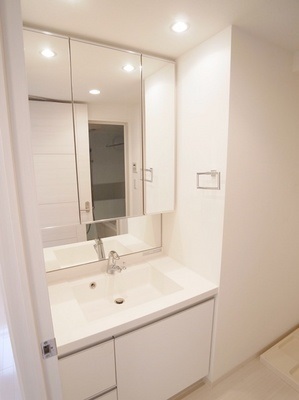 Washroom. It is fashionable and functional three-sided mirror