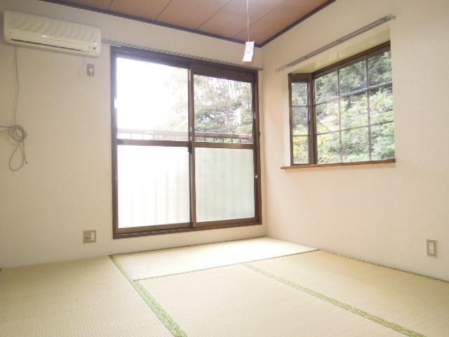 Balcony. There is also a bay window in the corner room.