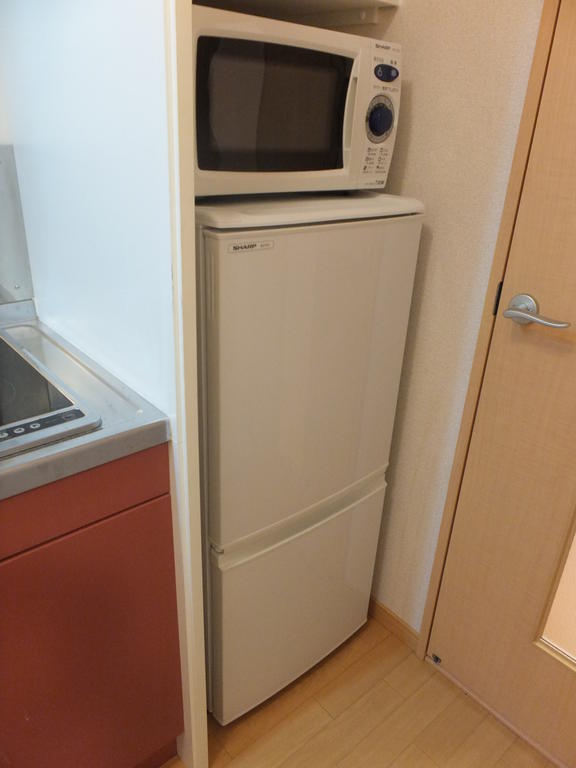 Other room space. microwave, It is with a refrigerator