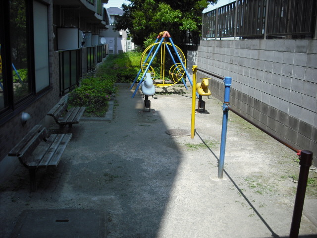 Other. Playground equipment space in front building! 