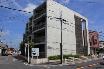 Building appearance. This design rental housing of exposed concrete shine in blue sky ☆