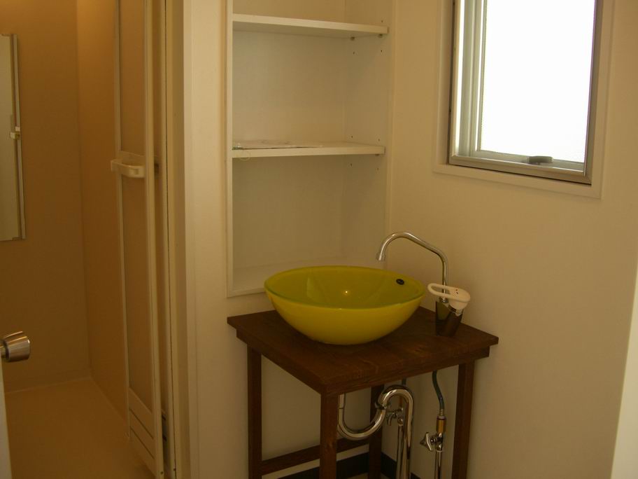 Washroom. Fashionable made of yellow glass