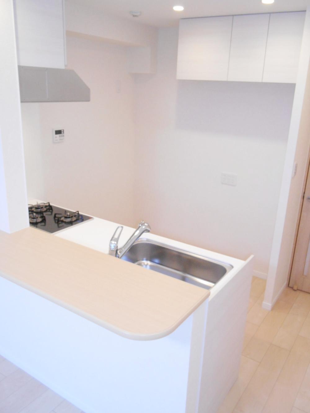 Kitchen. Because it placed the cupboard on the back, It has become open-minded made