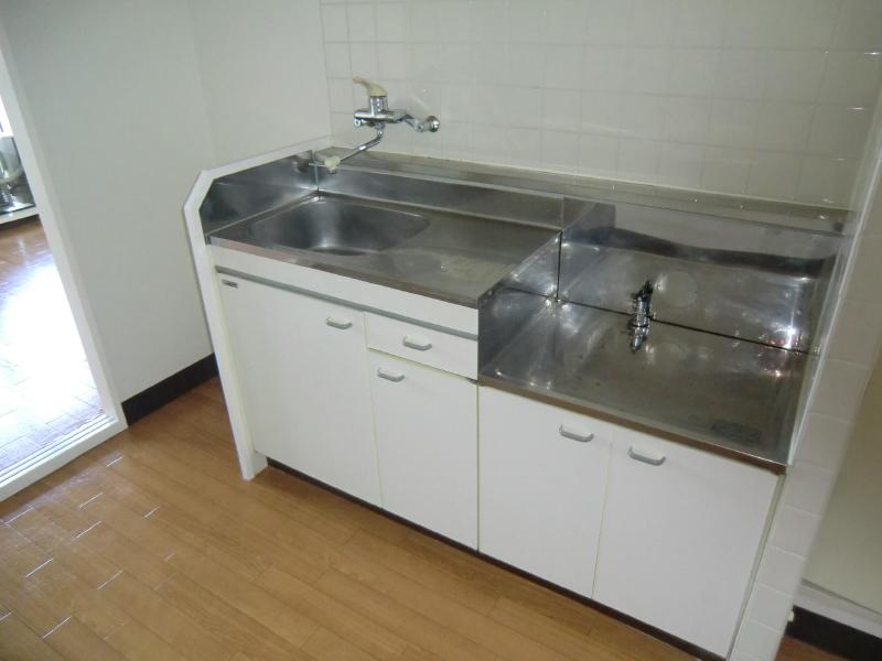 Kitchen. Two-burner gas stove can be installed spacious sink