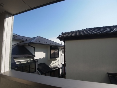 Balcony. View from the balcony. It is located in a residential area.