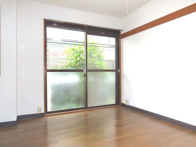 Living and room. It is a bright room with large windows.