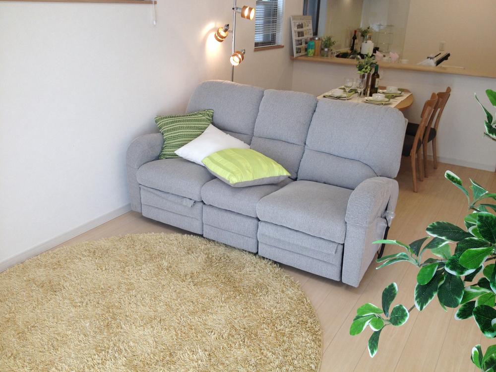 Living. Living entering the warm sunshine from the window. It is easy to image since the model building there is a furniture.