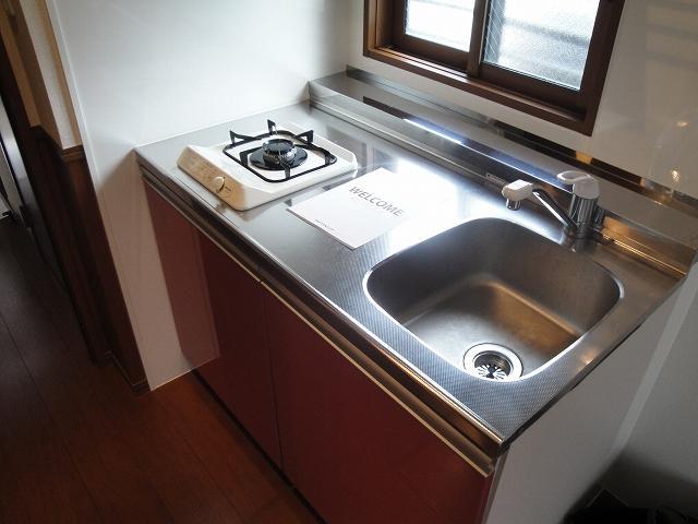 Kitchen. Kitchen is equipped with gas stove.