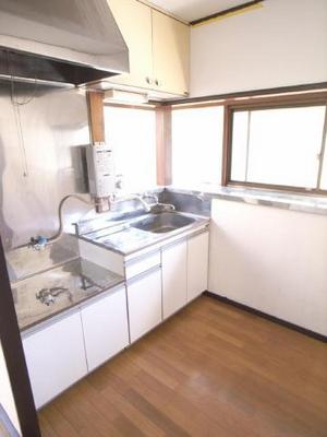 Kitchen. It is also very bright around the kitchen because there is a bay window