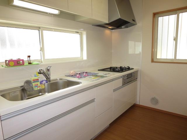 Kitchen. There are large windows and bright kitchen.