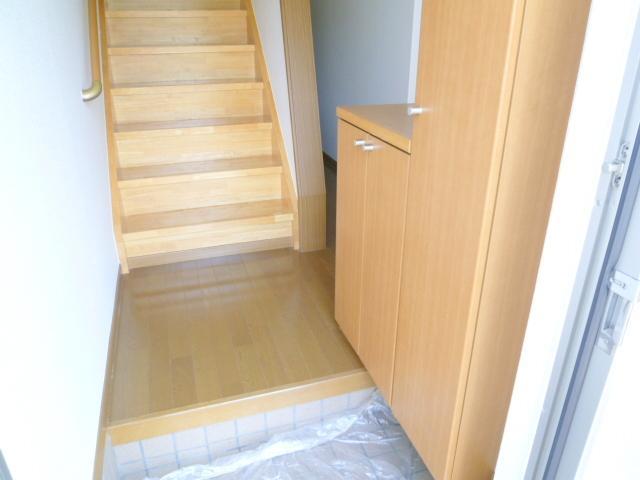 Entrance. Large cupboard. There is also storage under the stairs in the back.