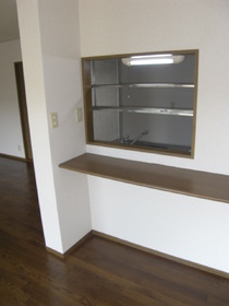 Living and room. It is counter kitchen