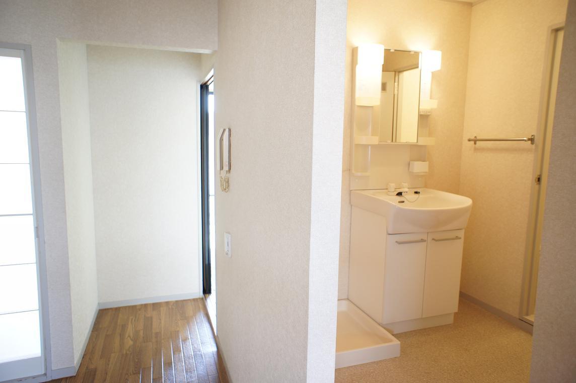 Other room space. Vanity dressing room (washbasin left Laundry Area)