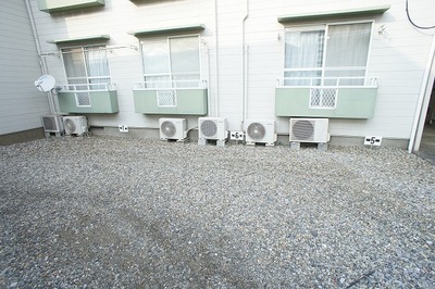 Parking lot. Before the balcony has become a parking lot of gravel.