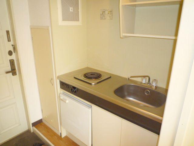 Kitchen. With a mini fridge. Electric stove