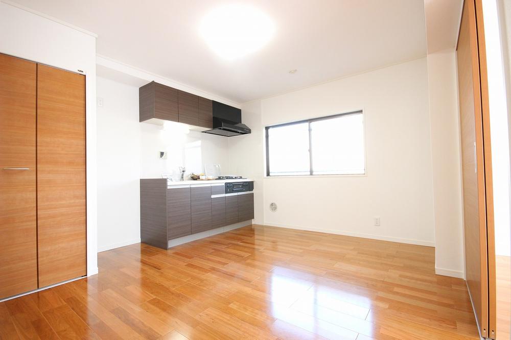 Living. The interior is unified in the natural wood color