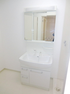 Washroom. Wash basin of a large mirror Is Dresser type