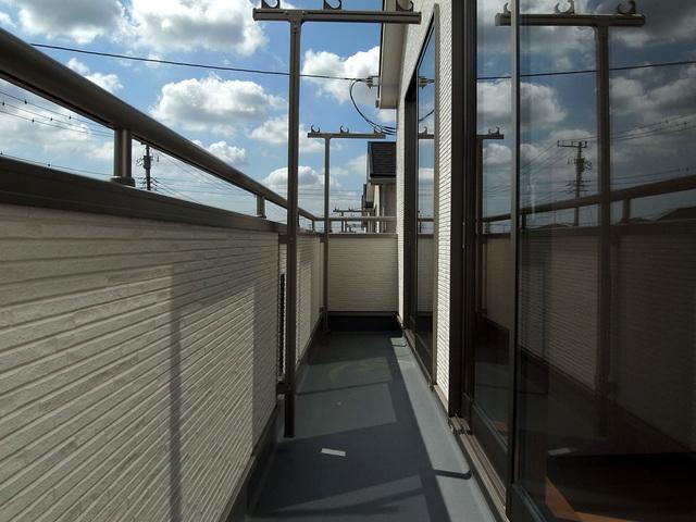 Balcony. Wide balcony that spans two rooms