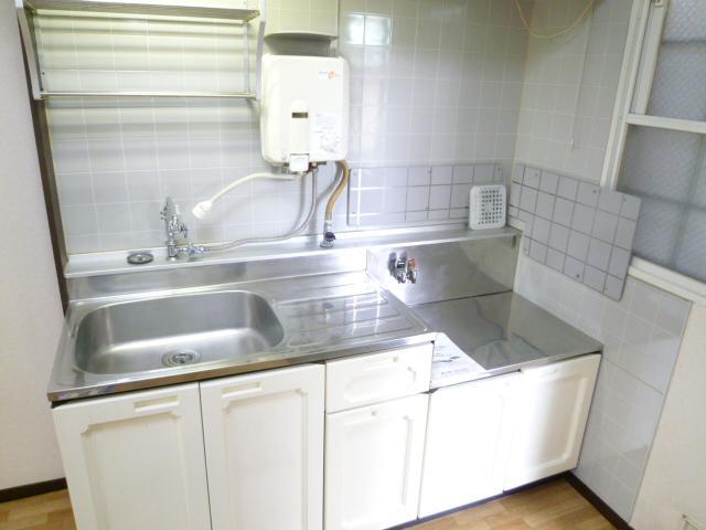 Kitchen. Two-burner stove put clear of the kitchen