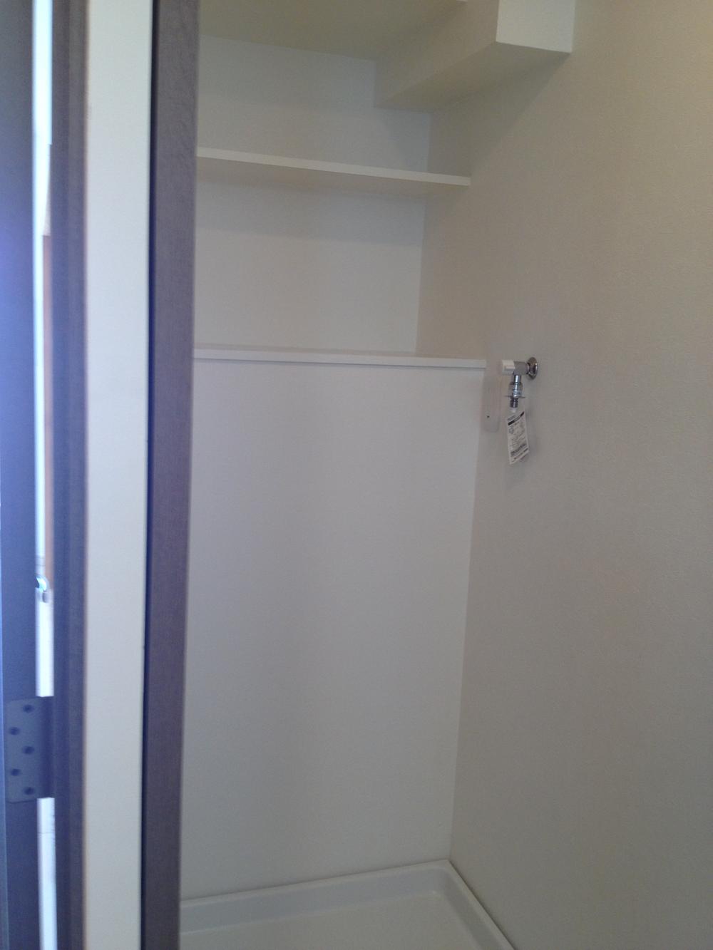 Wash basin, toilet. There is a shelf on top of the washing bread! This is useful for put away detergent, etc..