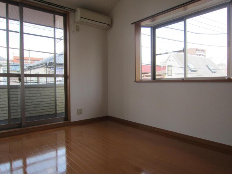 Living and room. There are two windows, It is very bright. 