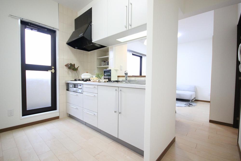 Kitchen. There is a back door, Bright kitchen