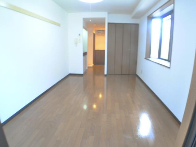 Living and room. It is spread in the room.