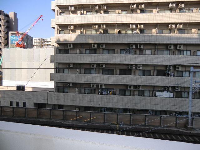 Balcony. But there is also a large building Sunny