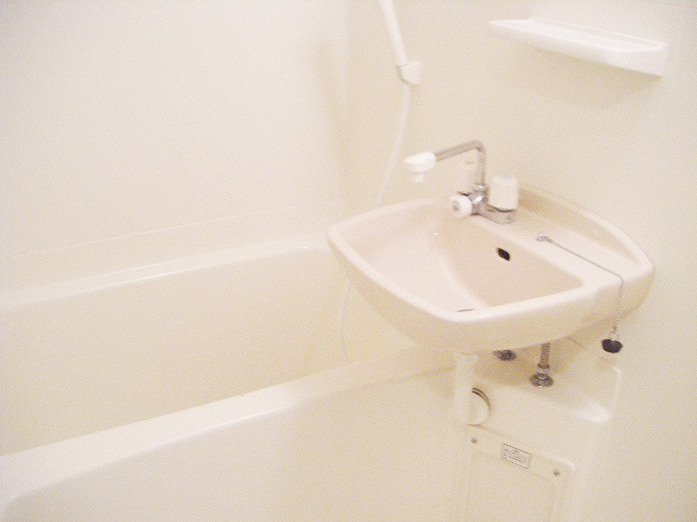 Bath. It is with wash basin.