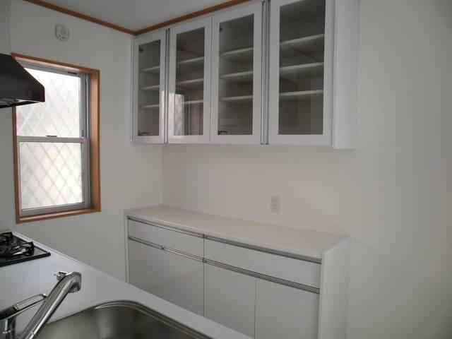 Kitchen. It is with cupboard.