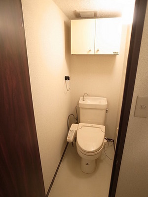 Toilet. Same building. It is a photograph of another room.