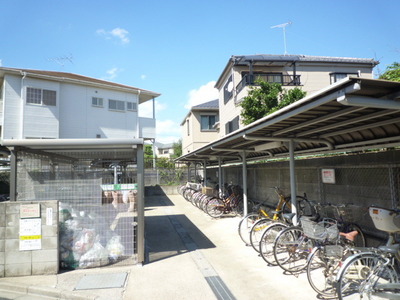 Other common areas. Bicycle parking lot with a happy even on a rainy day roof.