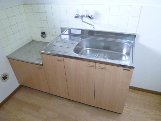 Kitchen. And put a two-burner stove, And put the cutting board.