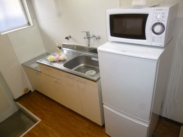 Kitchen. refrigerator, A kitchen with a microwave oven