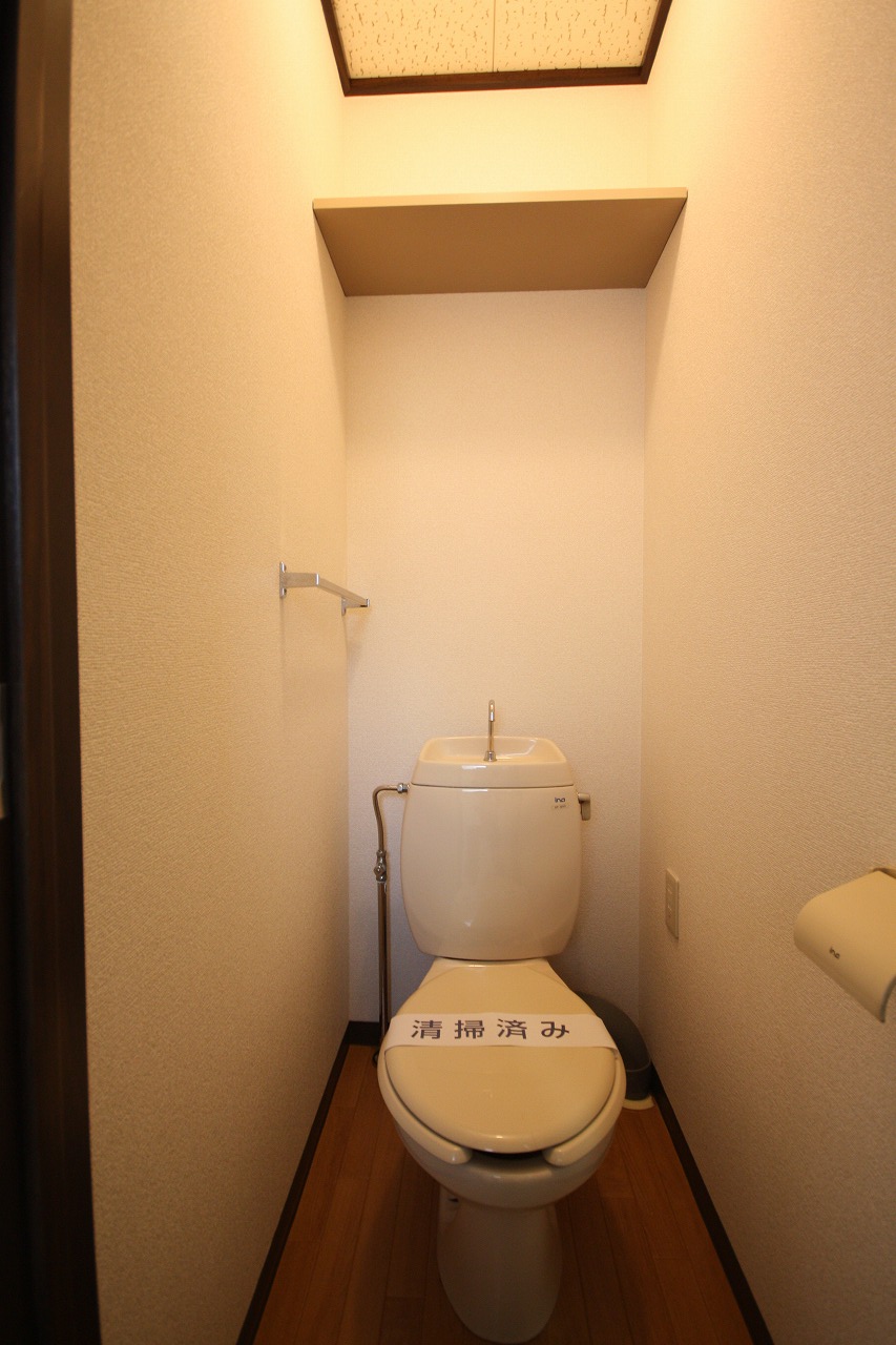 Toilet. With a storage rack, It is very convenient