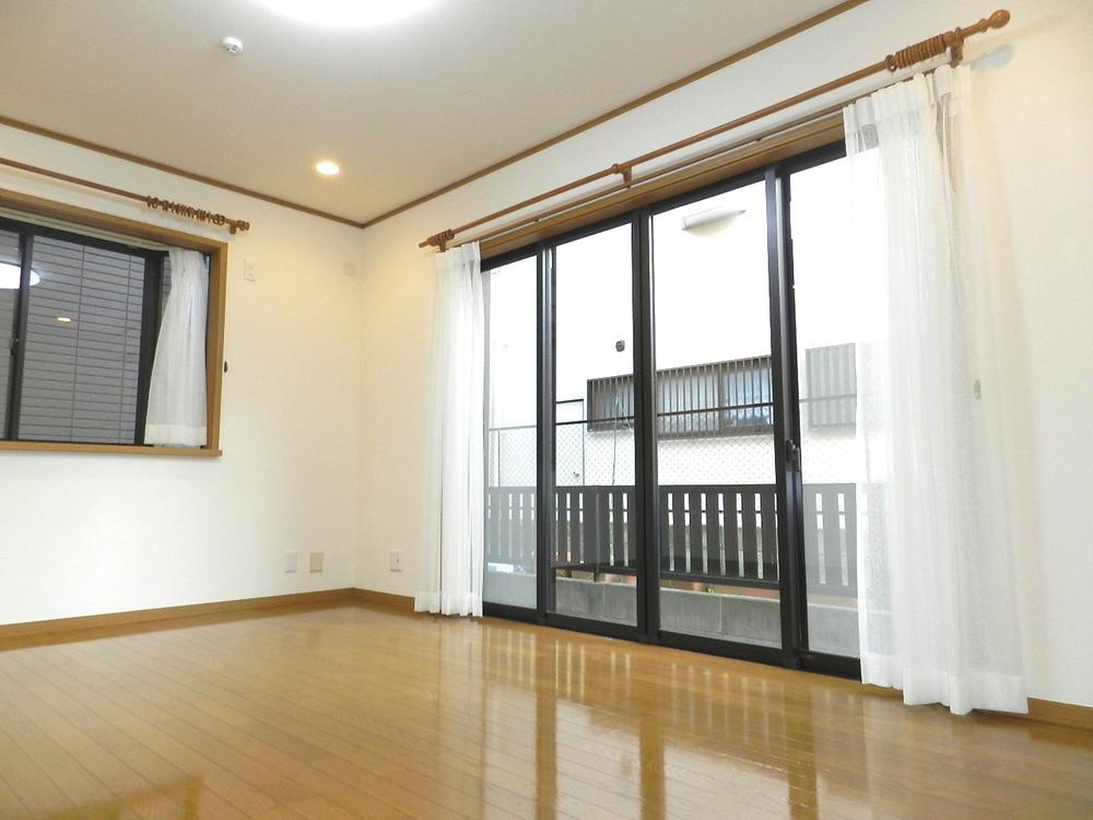Living. South window is bright in the window of the wide span.