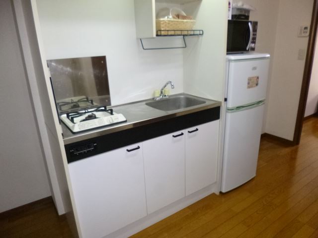 Kitchen. refrigerator, A kitchen with a microwave oven