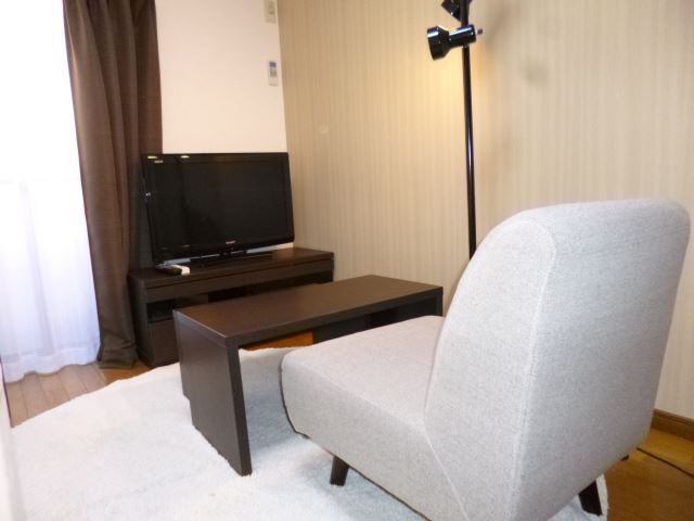 Other Equipment. 32-inch TV and a 1-seater sofa