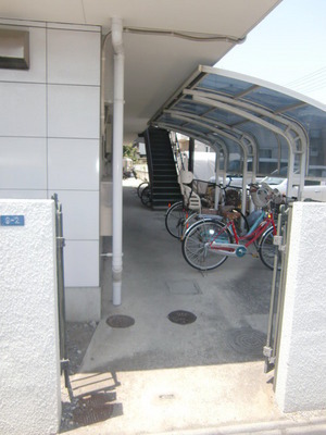 Entrance. Happy Covered bicycle parking.