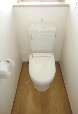 Toilet. It is a bathroom that is clean.