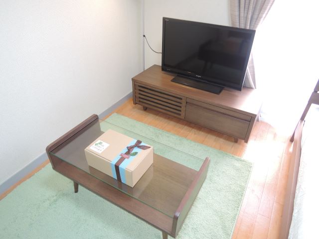 Living and room. 32-inch TV, Thank TV stand