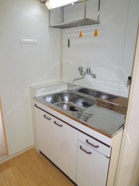 Kitchen. It is a gas stove definitive room. 