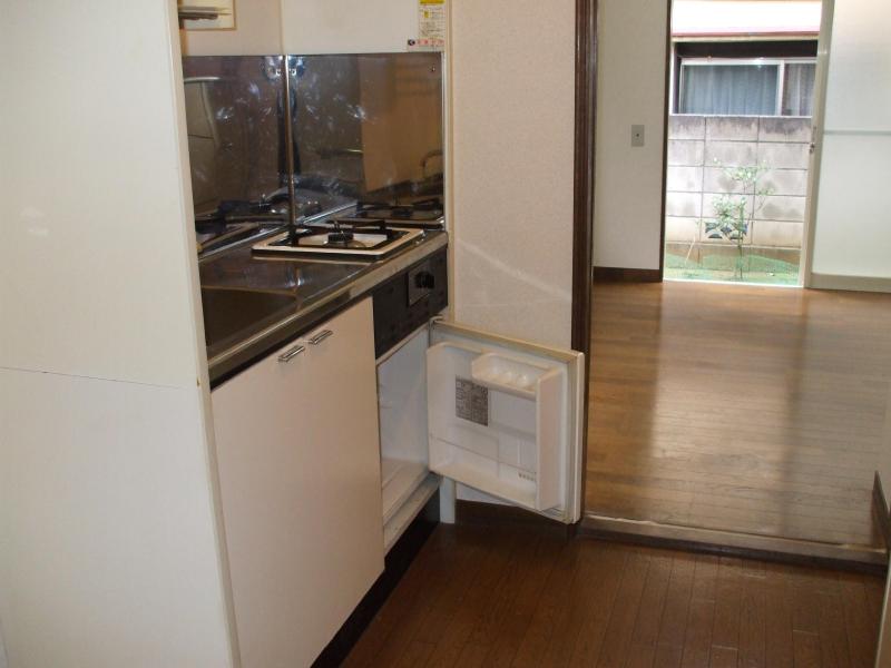 Kitchen. 1 lot gas stoves and with a mini fridge