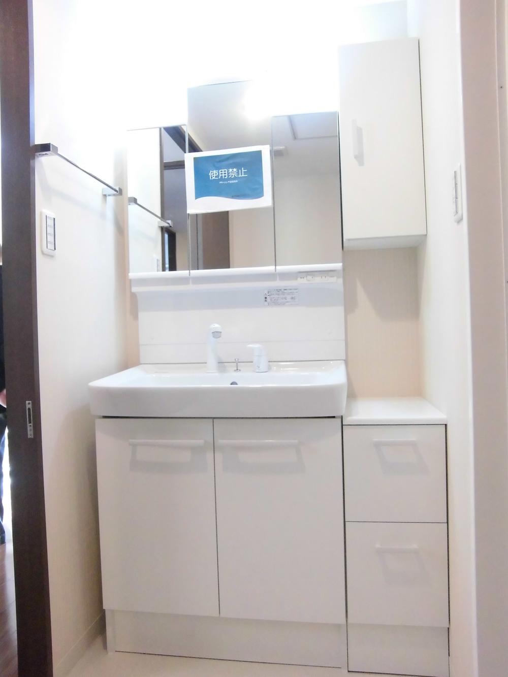 Wash basin, toilet. It is the washroom