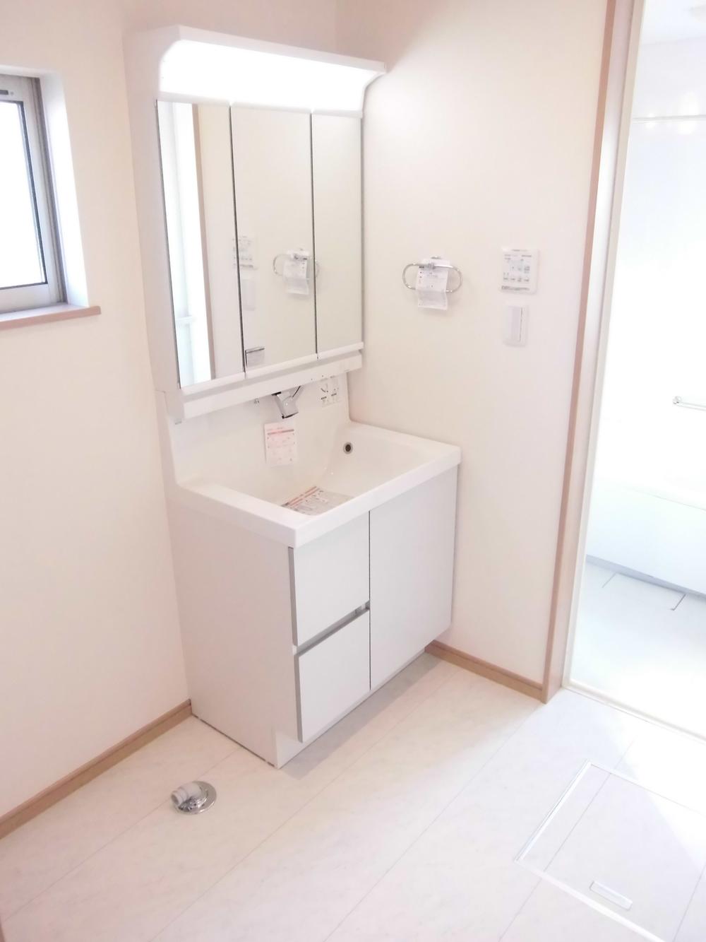 Wash basin, toilet. About 1 square meters of washroom