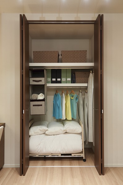 Closet-type storage also fit and clean bulky futon
