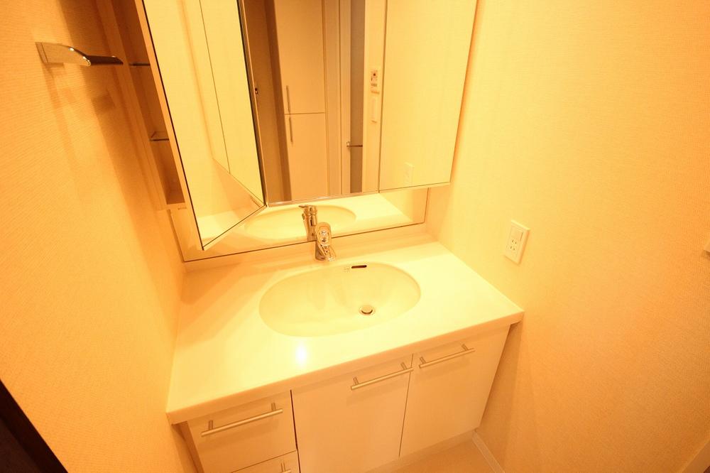 Wash basin, toilet. Wash basin is also very beautiful of the three-sided mirror